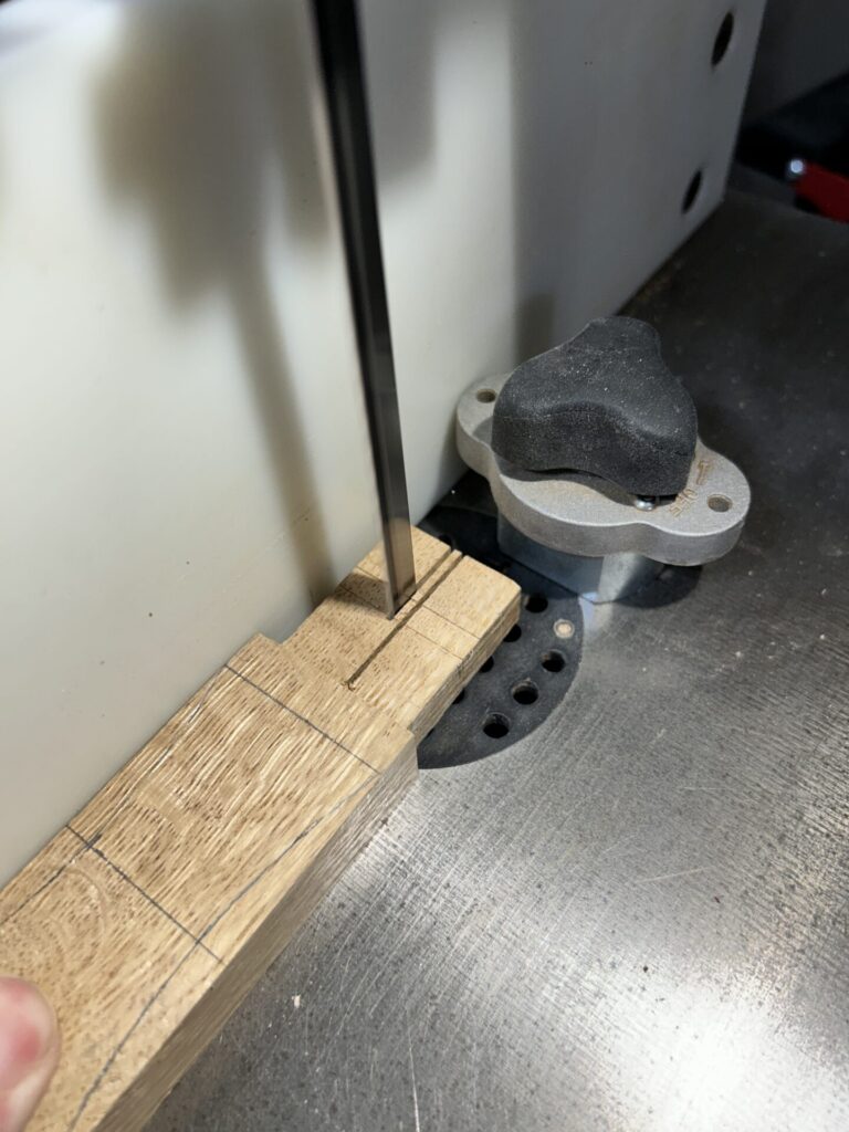 Cutting a slot in the handle tenon at the bandsaw