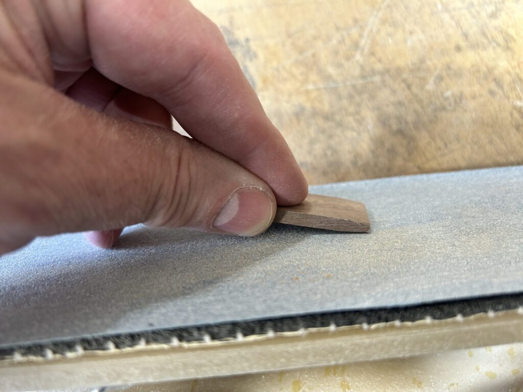 Sanding a slight taper on the wedge