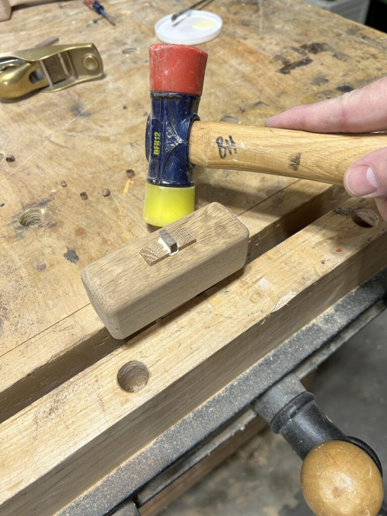 Gluing the mallet head to the handle with a wedge in the tenon