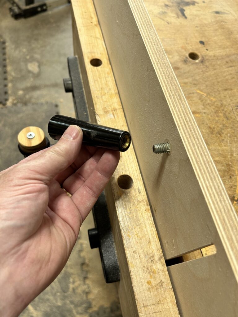 Install the handle to the base